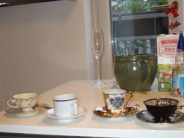 In the image we can see there is a table on which there are cups and saucers on the table and there...
