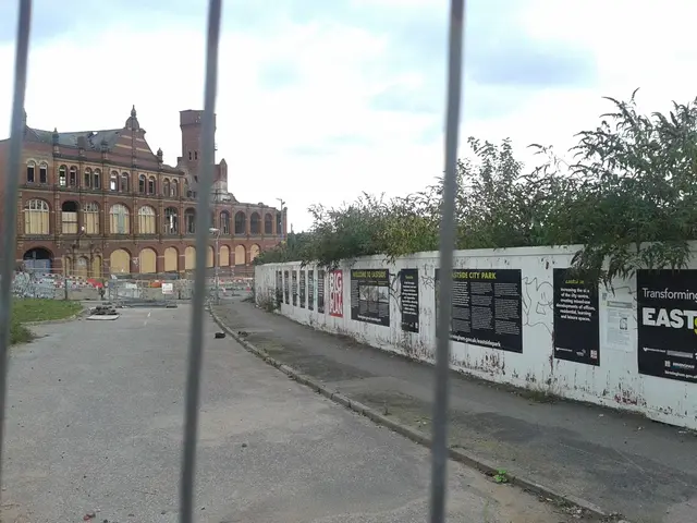 On the left side it's a road and this is a very big building. The right side this is wall and their...