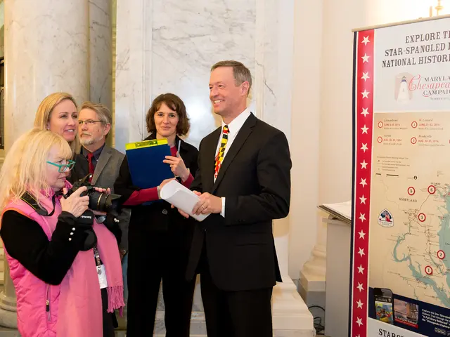 In this picture I can see the banner on the right side. I can see a woman holding the camera on the...