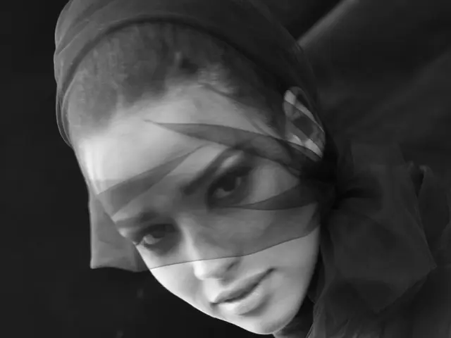 This is black and white image, in this image there is a lady.