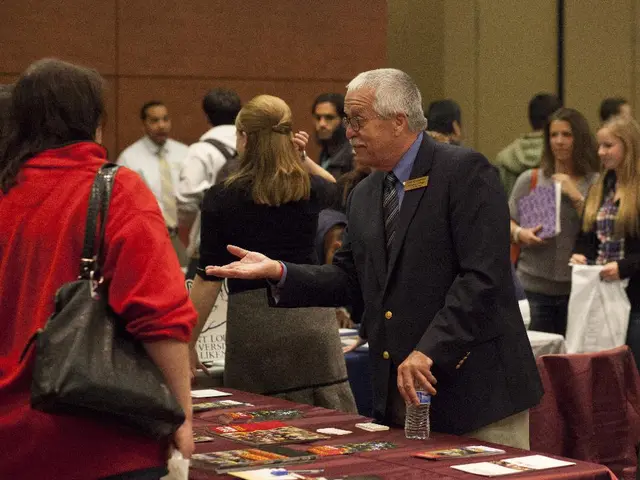 There are a lot of people in a hall and all of them are talking to each other and in between the...