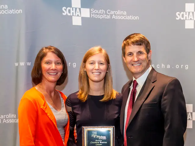 In the picture i can see three persons two women, a man wearing black color suit, women wearing...