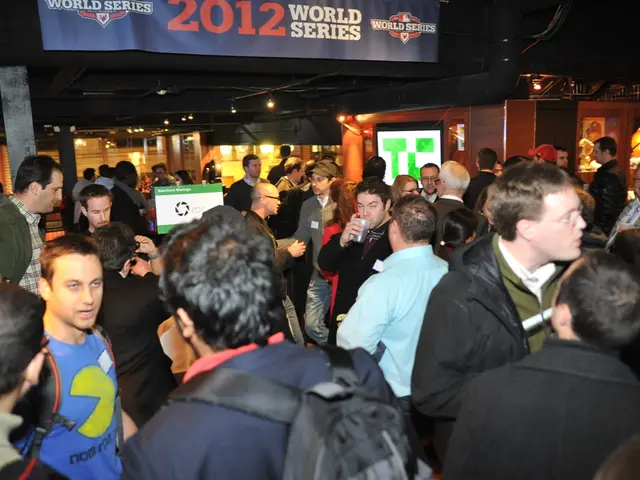 In the picture there is a huge crowd and it looks like some event, behind the people on the right...