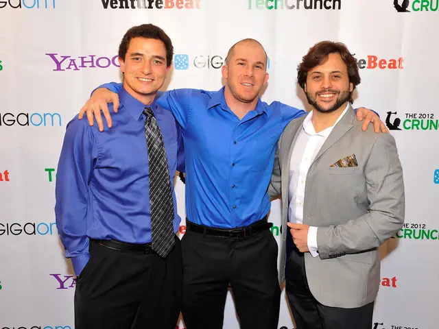 In this image, we can see three persons in front of the sponsorship cardboard banner. These persons...