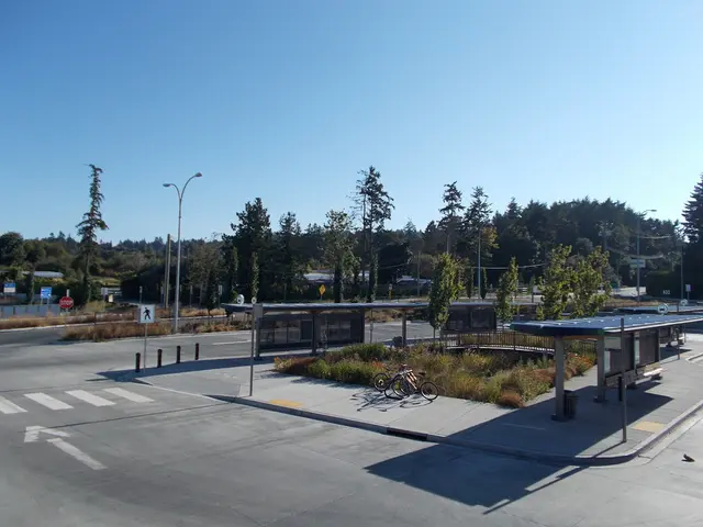 In this image we can see road, shed, street lights, bicycles on the pavement, shed, iron fence,...