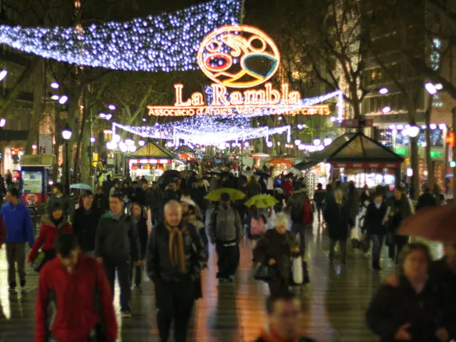 In this picture we can see there are groups of people on the walkway. Some people holding the...