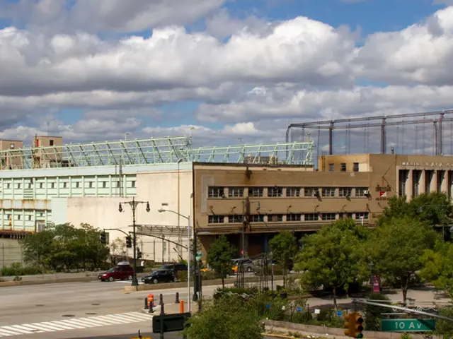 In the image there is a road, vehicles, trees, street lights, a water surface and a huge...