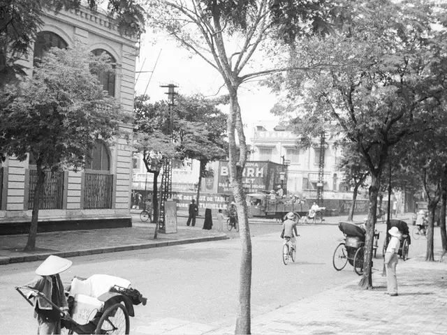 In this picture there is a old building with window. Behind we can see white color building and...