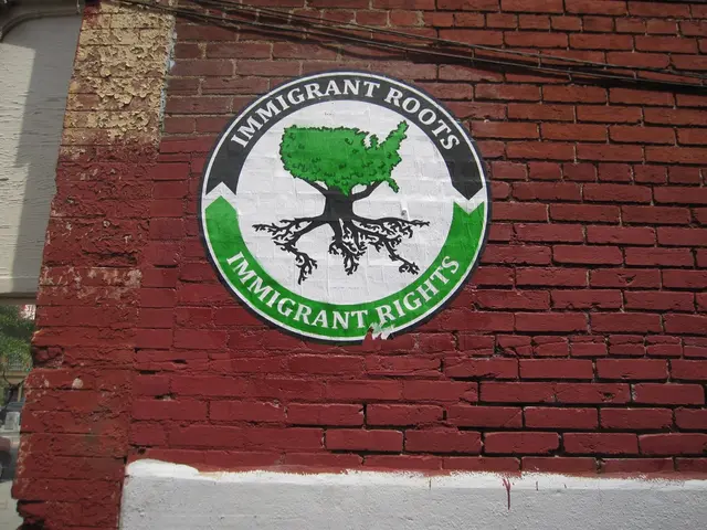 It is a poster on the brick wall.