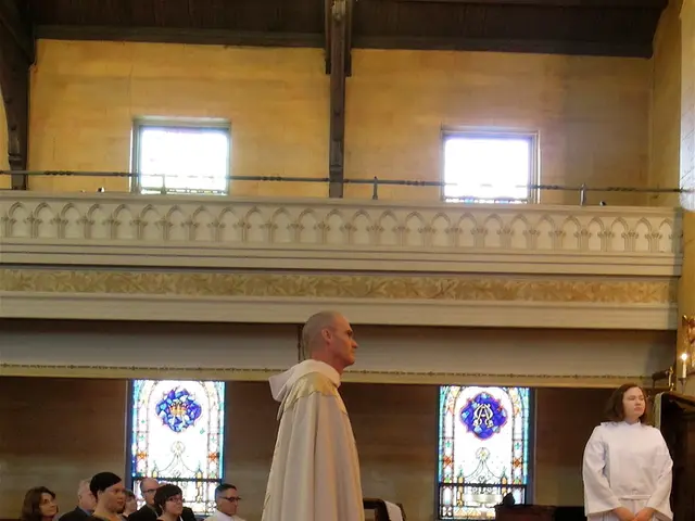 At the bottom, we see a carpet in red color. On the right side, we see a railing. Behind that, we...