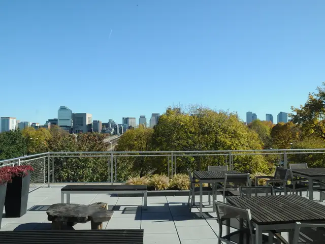 It seems to be the image is taken inside the restaurant. In the image there are table and chairs,...