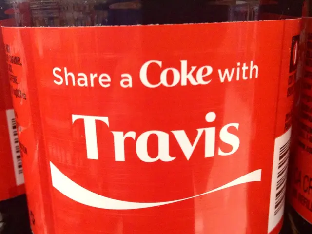 In the image we can see there is a bottle on which it's written "Share a coke with TRAVIS".