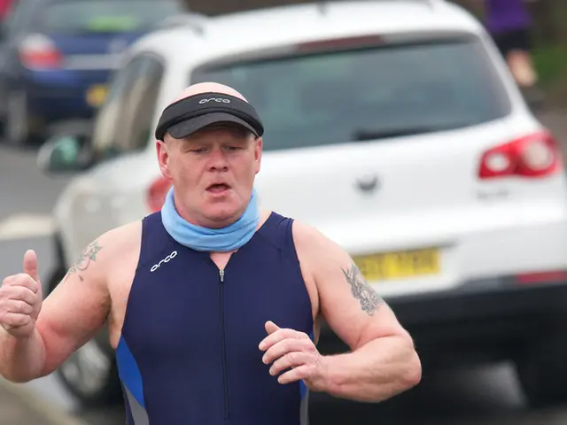 In this picture there is a man who is running on the left side of the image and there are cars in...