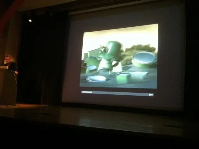 To the left side of the image there is a person standing near a podium. In the background of the...