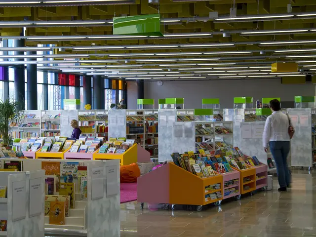 This picture looks like a library, I can see few books on the shelves and I can see a plant and few...
