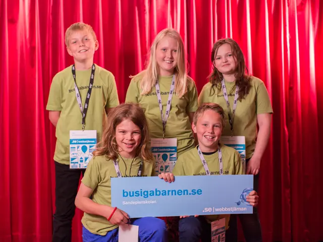 In this image we can see group of children wearing id cards. A boy and a girl are holding a board...