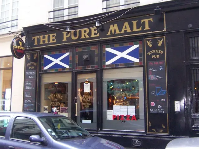 In this picture we can see the shop with glass door. On the there is a white color building with...