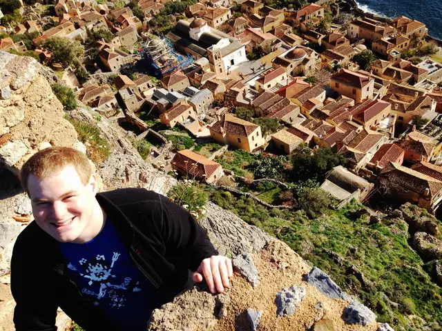 On the left side of the image there is a man with black jacket and blue t-shirt is standing and he...