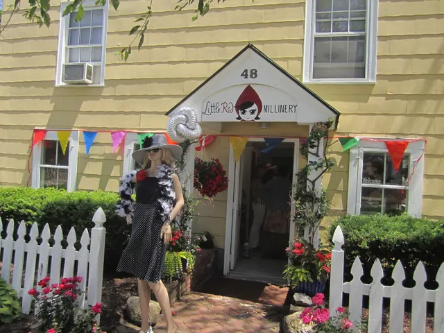 In this picture we can see few shrubs, fences, flowers, plants and a mannequin, in front of the...