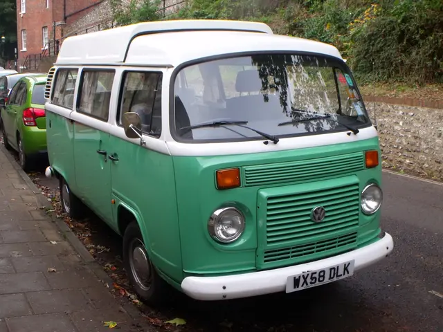 In the image I can see the road, few vehicles on the road and the sidewalk. In the background I can...