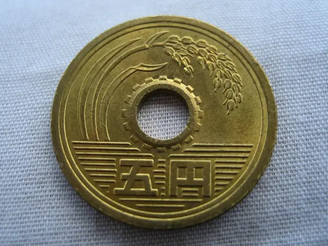 In the center of the image, we can see a gold color coin and at the bottom, there is cloth.