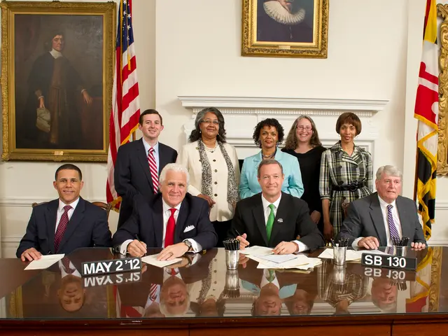 There are group of persons standing and sitting in this image. In the front the four persons are...