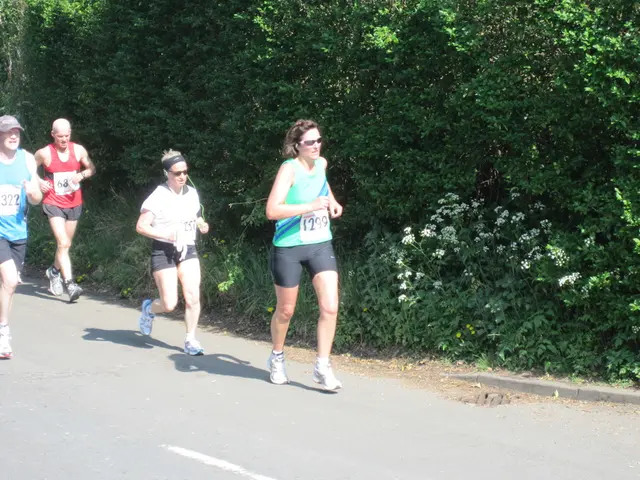 This is the picture of some people who are on the road and around there are some plants and trees.