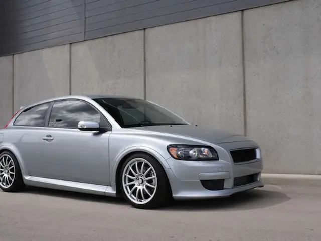 It is a car in silver color and this is the wall.