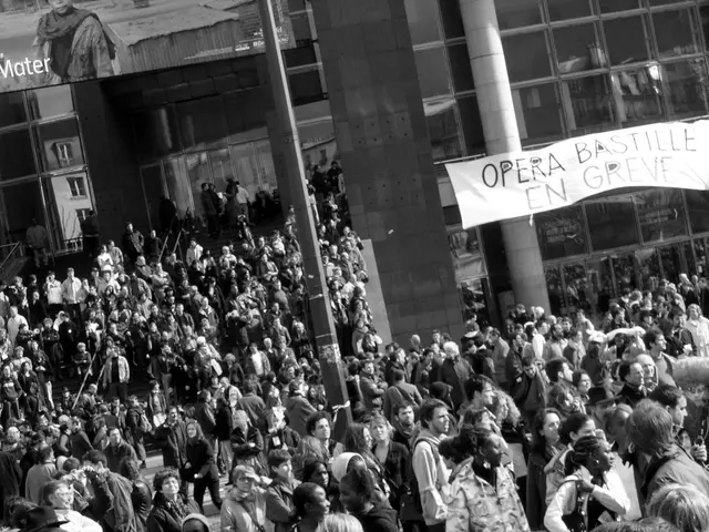 In the picture I can see a group of people. I can see the banner on the top right side. It is...