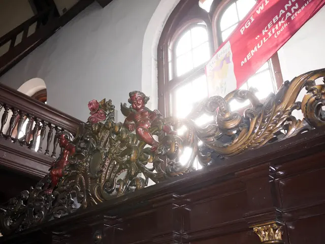 In this picture, there are cabinets at the bottom. On the cabinets, there are statues. On the top,...