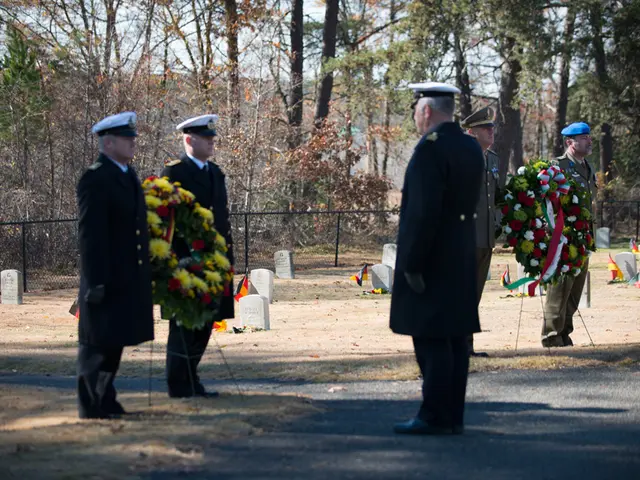 In this image there are two officers standing on the floor by holding the garland. In front of them...