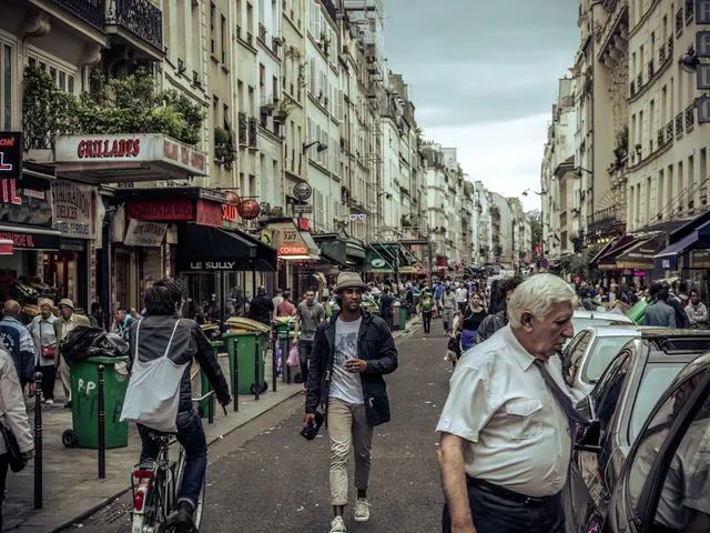 There are two big buildings on the opposite side of each side and a road in between them in which a...