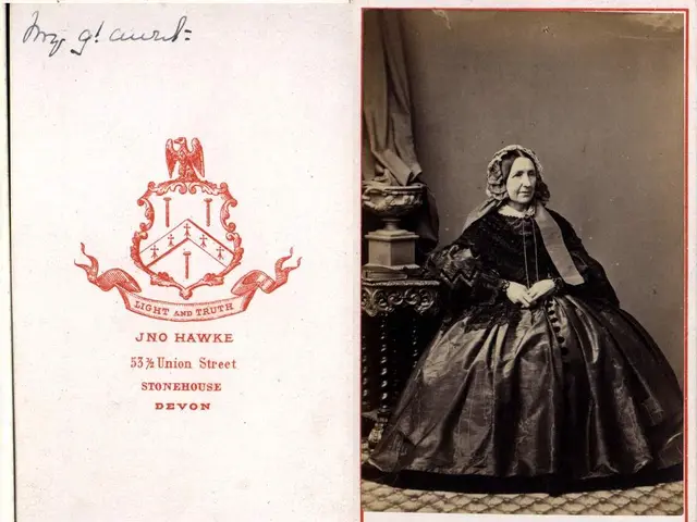 In this image there is a picture of lady sitting on the chair beside that there is a pillar and...