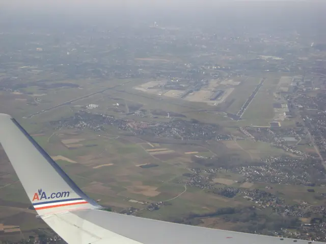 This picture consists of an aerial view, it seems to be there is a wing of an aeroplane at the...