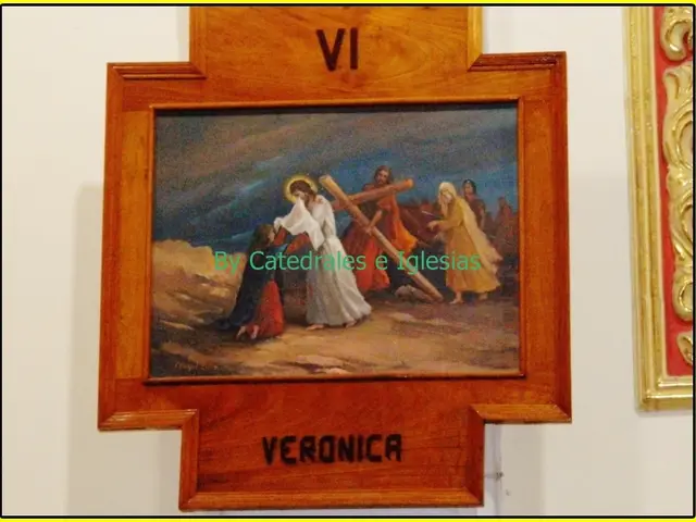 In this image I can see there is a photo frame placed on the wall and there is an image of people...