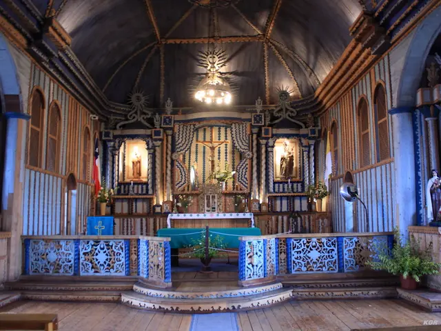 This is an inside view of a building. In this picture we can see a few houseplants, statues and a...