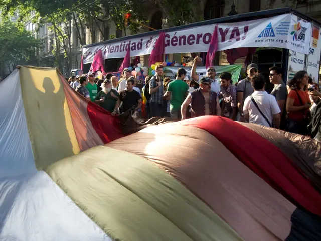 In the foreground of this image, there is a big cloth holding by few people behind it. There are...