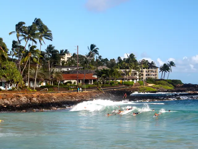 In the picture there is water, there are people swimming in the water, there are stones, there are...