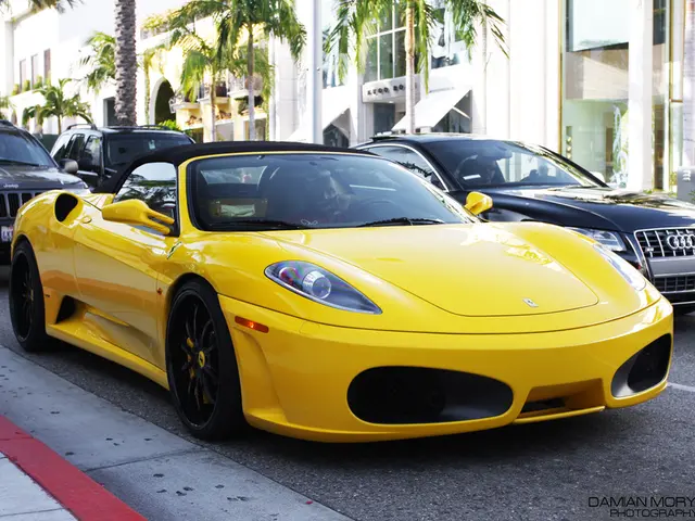 In this image in the center there are some vehicles on the road, in the background there are some...