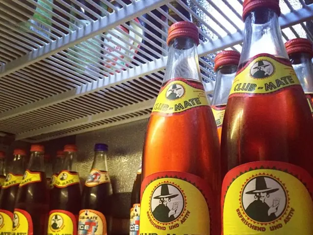 In this picture we can see some bottles in the rack.