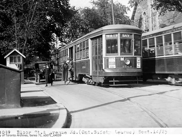 This is a black and white image. I think these are the trams. I can see a car on the road. I can...