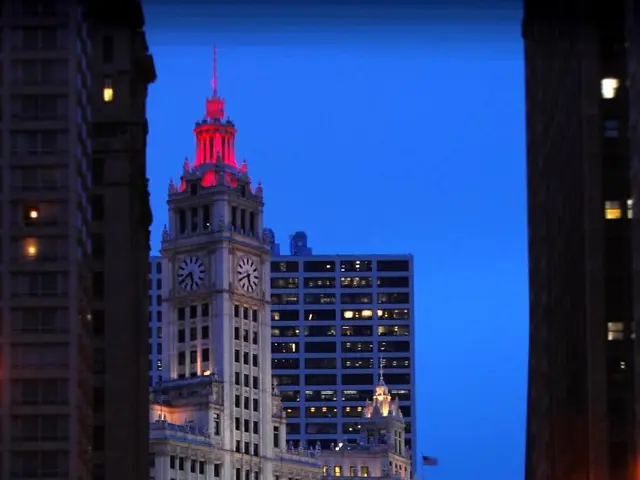 It is a city, the image is captured in the evening time and the roads are very bright with many...