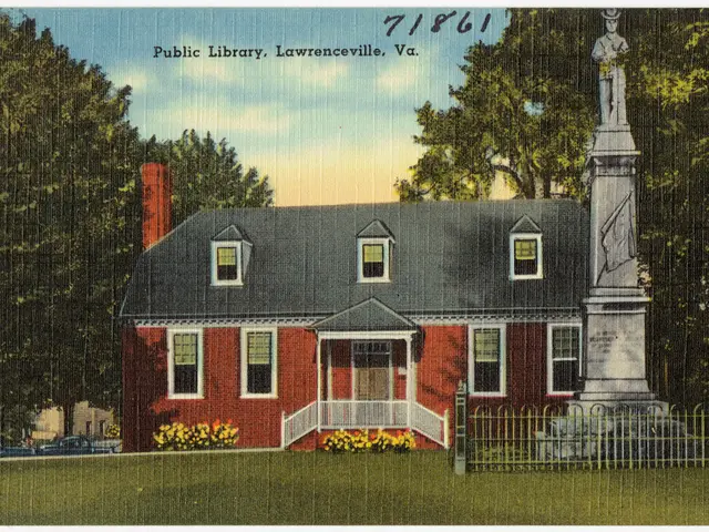 This is a photo and here we can see sheds and there are trees, flower plants and there are railings...
