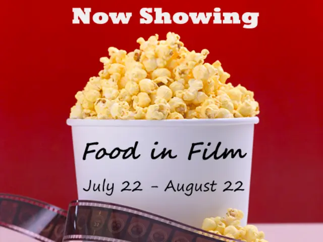 In this image we see paper popcorn box filled with popcorn.