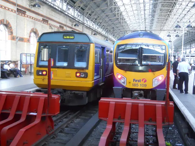 In the center of the image trains are there. At the top of the image roof is there. At the bottom...