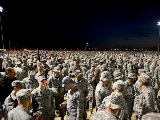 Here we can see a group of people. Most of the people wore military dress and caps. These are light...