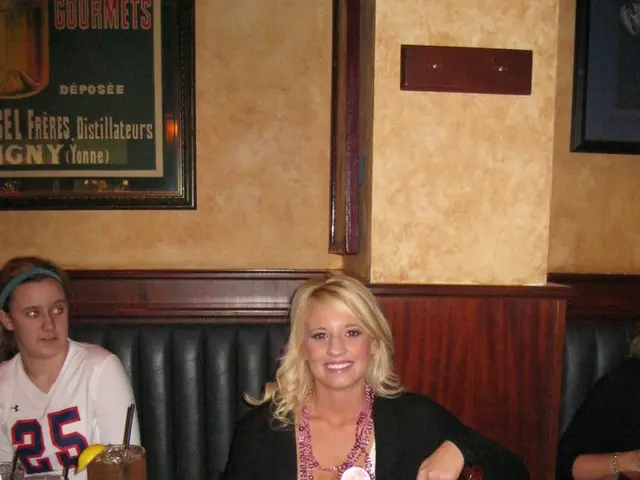 This picture shows an inner view of a building. Two frames hanging on a wall and one object hanging...