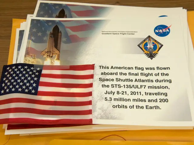 In this image in the center there are some posters, on the posters there is text and there is a...