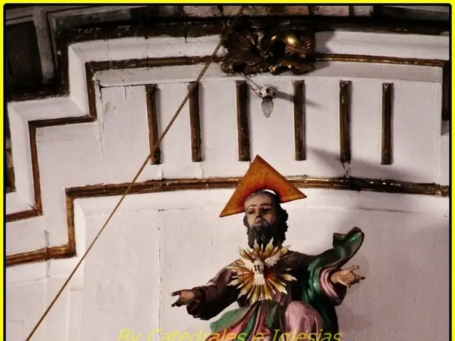 In the foreground of this image, there is a sculpture and a wall and it seems like a cable on the...