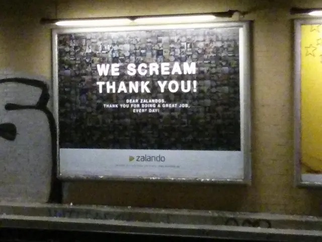 Hoardings are on the wall. Above this hoardings there are lights.